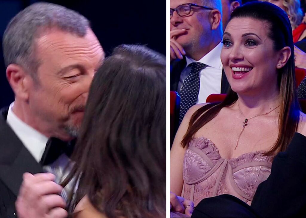 Amadeus bacia sulla bocca Rocìo Munoz Morales a Sanremo: la reazione della moglie, guarda