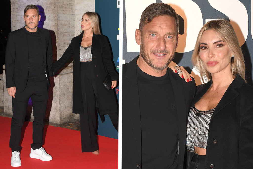 Francesco Totti e Noemi Bocchi per la prima volta sul red carpet insieme a Roma: la coppia in posa, fotografi impazziti